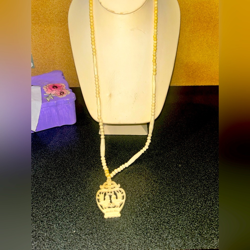 Plastic carved vintage bird necklace